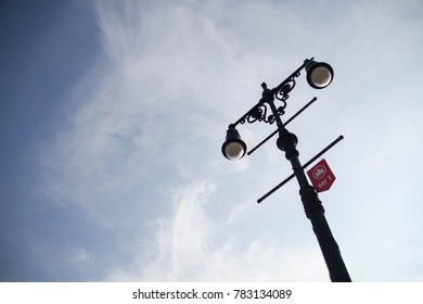 Light pole with cloudy sky in evening