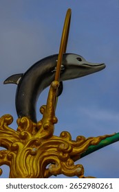 Light pole with a dolphin statue at Sunset Blue hour in Patong in the island of Phuket Thailand 