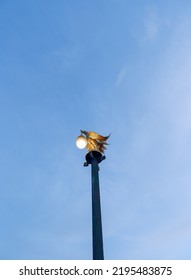 The Light Pole At The End Is Shaped Like A Fairy Tale Animal, Behind Is A Beautiful Sky.