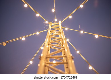 Light Pole With String Wired Bulbs On Sky Background