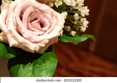 Light Purple Rose Called A Sterling Silver Rose Bouquet In A Glass Vase.