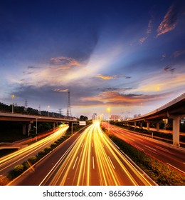 Light Rail On The Overpass At Night