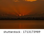 light ray when orange sunset in the lake