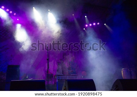 light rays on a dark background of the stage during a rock concert, blurred background. Web banner. Element of design.