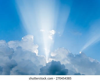 Light Rays Shine Through Clouds