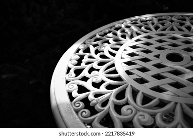 Light Reflex On Stenciled Round Table In Black And White Mode