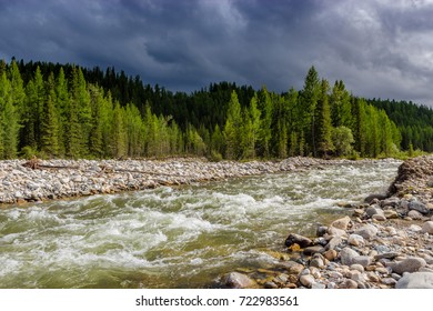 light river, dark clouds
