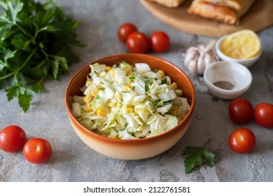 A Light Salad Of Peking Cabbage, Corn And Vegetables For Breakfast For The Whole Family. Close-up