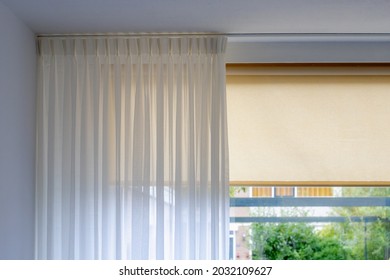 Light and see through concept, Classic white sheer curtains hanging by the window in the room with blurred outside view as background. - Powered by Shutterstock