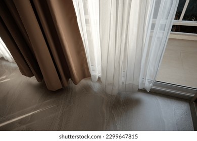 Light and see through concept, Classic white sheer curtains hanging by the window in the room with blurred view outside as background. - Shutterstock ID 2299647815