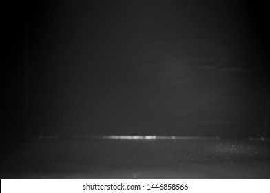 Light and shadow in a black room with empty space