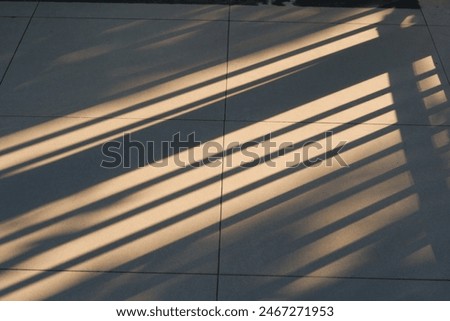 Light and shadow concept, Sunlight shines through the iron curtain, Abstract shape of morning light and slash shadow