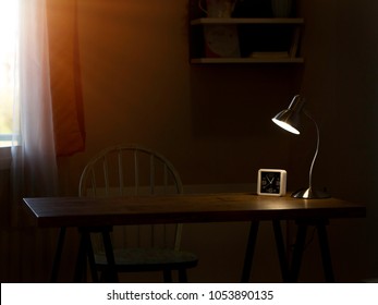 Light And Shadow In The Dark Room With Lamp On The Table