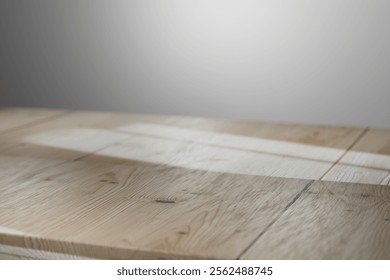 Light and shadow interplay on a rustic wooden tabletop.
