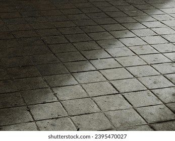 Light and shadow Triangles. Shape. Abstract . Dirty ground. Stones surface. Pattern and texture. Layers.