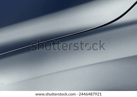 Light and shadows on a surface of a metallic sheen car