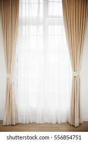 Light shines through white curtains in room - Shutterstock ID 556854751