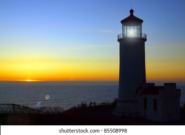 Light Shining In The North Head Lighthouse On The Washington Coast At Sunset