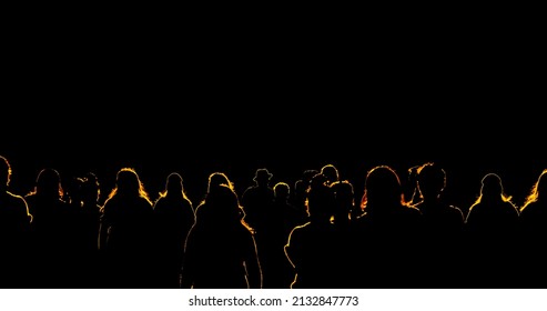 Light Shining On Crowd Of People With Yellow Outlined Silhouettes Of Bodies On A Dark Black Background