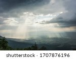 Light shining through the clouds in the valley