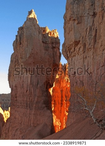 Light shining through two limestone hoodos in Bryce Canyon in Utah USA