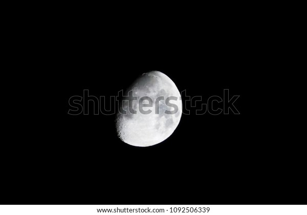 the Light Side of the Moon, First Quarter Moon with\
Craters in the Dark