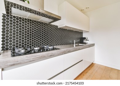 Light Small Home Kitchen With Wide Window Furnished With Cupboards And Shelves With Appliances In Modern Urban Apartment