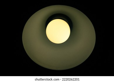 Light From A Small Table Lamp. Glowing Light Bulb