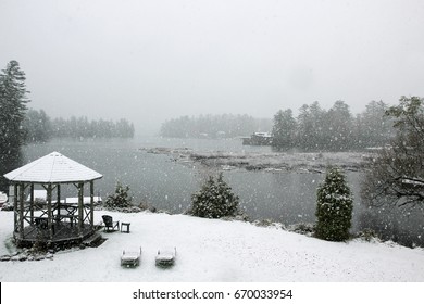 Light snow falling on Lake Placid, lawn chairs and gazebo, State of New York - Powered by Shutterstock