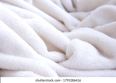 Light soft, fluffy, light blanket. Texture white cotton towel background