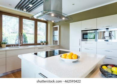 Light And Spacious New Design Kitchen With Island And High Gloss White Furniture