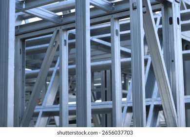 Light steel thin-walled structures. Frames for warehouses, garages and houses. Steel frame construction for construction. Details. Light steel frame fragment close-up. Construction concept