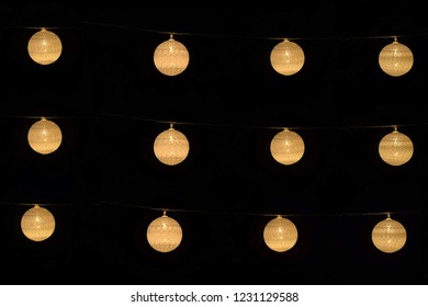 Light string bulb glowing in dark night