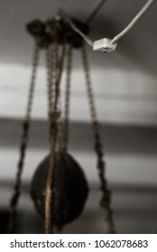 Light switch and old lamp hanging from the ceiling