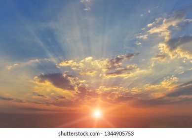 Light through the clouds, Sunbeams or Rays breaking through the dark clouds at sunset, hope , prayer god’s mercy and trace, beautiful spectacular conceptual mediation background,