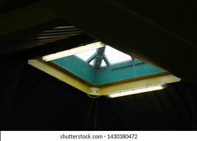 Light through dark rectangular skylight