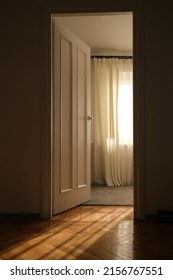 Light Through The Doorway And An Open Door In The Room