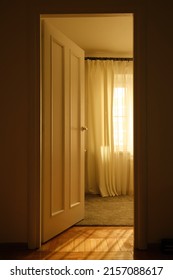 Light Through The Doorway And An Open Door In The Room