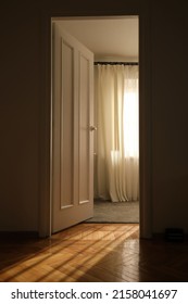 Light Through The Doorway And An Open Door In The Room