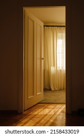 Light Through The Doorway And An Open Door In The Room