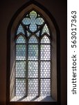 Light through a Gothic stone church window in Schaffhausen, Switzerland