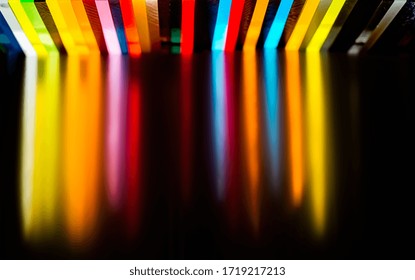 light through Stack of different colours Cast Acrylic Sheet on black background