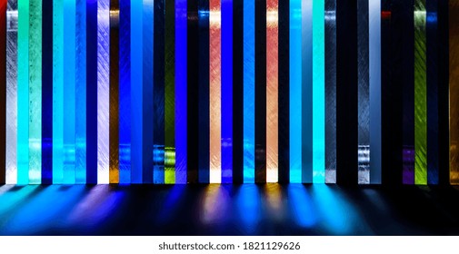 light through Stack of different colours Cast Acrylic Sheet on black background