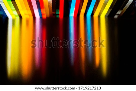 light through Stack of different colours Cast Acrylic Sheet on black background