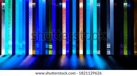 light through Stack of different colours Cast Acrylic Sheet on black background