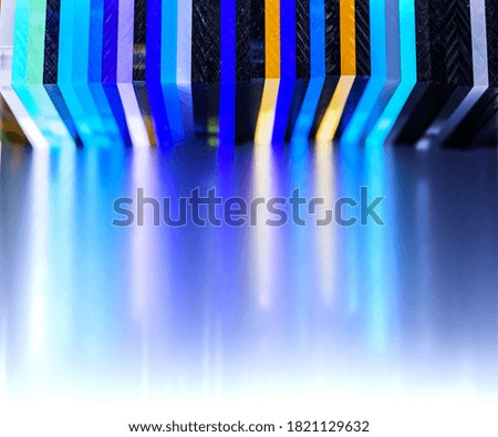 light through Stack of different colours Cast Acrylic Sheet on white background