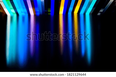 light through Stack of different colours Cast Acrylic Sheet on black background