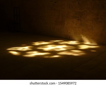 Light Through A Stained Glass Window In An Abbey