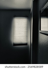 Light through the window reflecting on the mirror and shading the wall with light and shadows. 