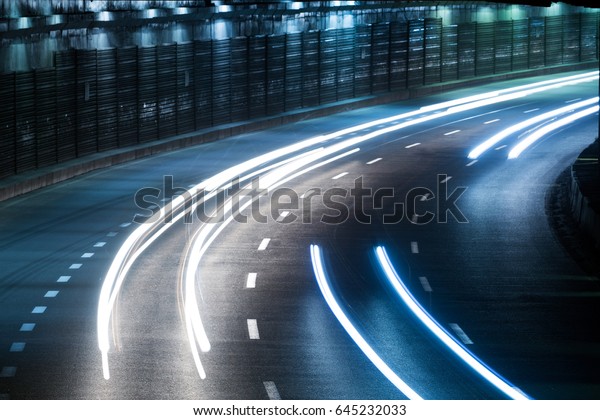 Light track of
moving cars in a dark
tunnel
